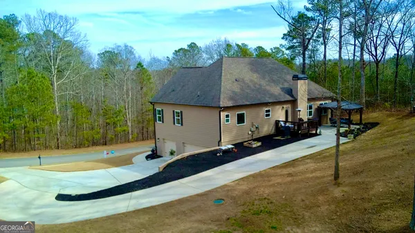 a view of a livingroom with furniture and a fireplace