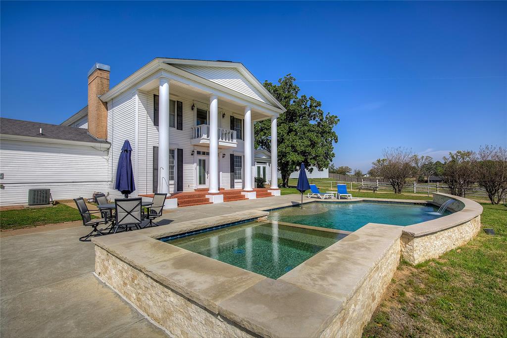 7359 Highway 154 Sulphur Springs, TX 75482 - Photo 8 of 40 Swimming pool with two waterfalls, hot tub, concrete decking