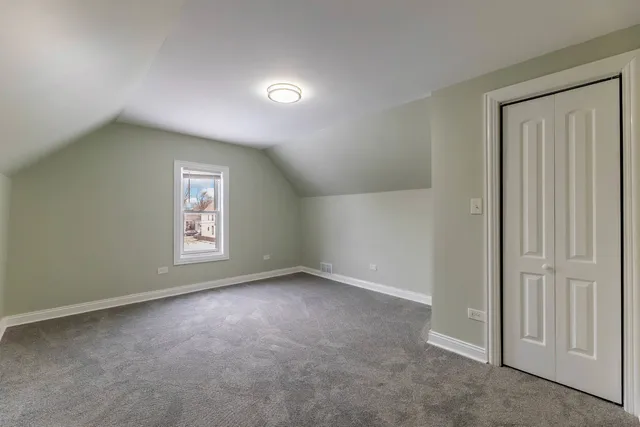 an empty room with a empty space and window