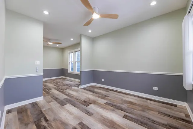 a view of room with window and ceiling fan