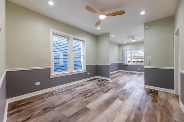 a view of livingroom with hardwood floor and a ceiling fan