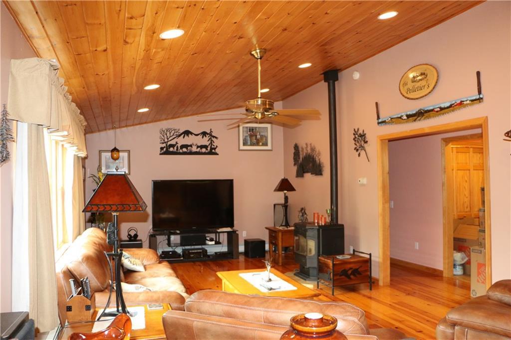 326 Patten Pond Road Surry, ME 04684 - Photo 11 of 35 Living room with heat stove