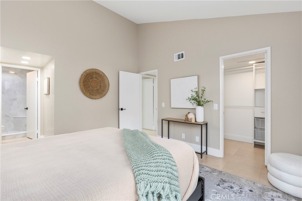 143 Timberline Court Brea, CA 92821 - Photo 17 of 35 a bedroom with a bed and a chandelier