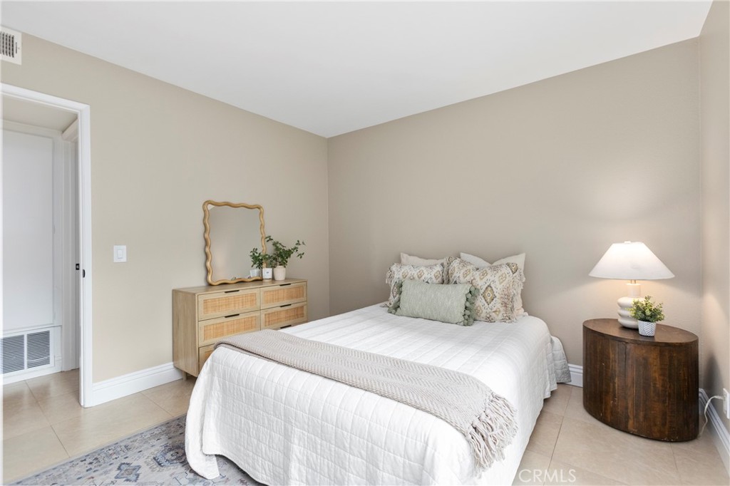 143 Timberline Court Brea, CA 92821 - Photo 19 of 35 a bedroom with a bed and a table