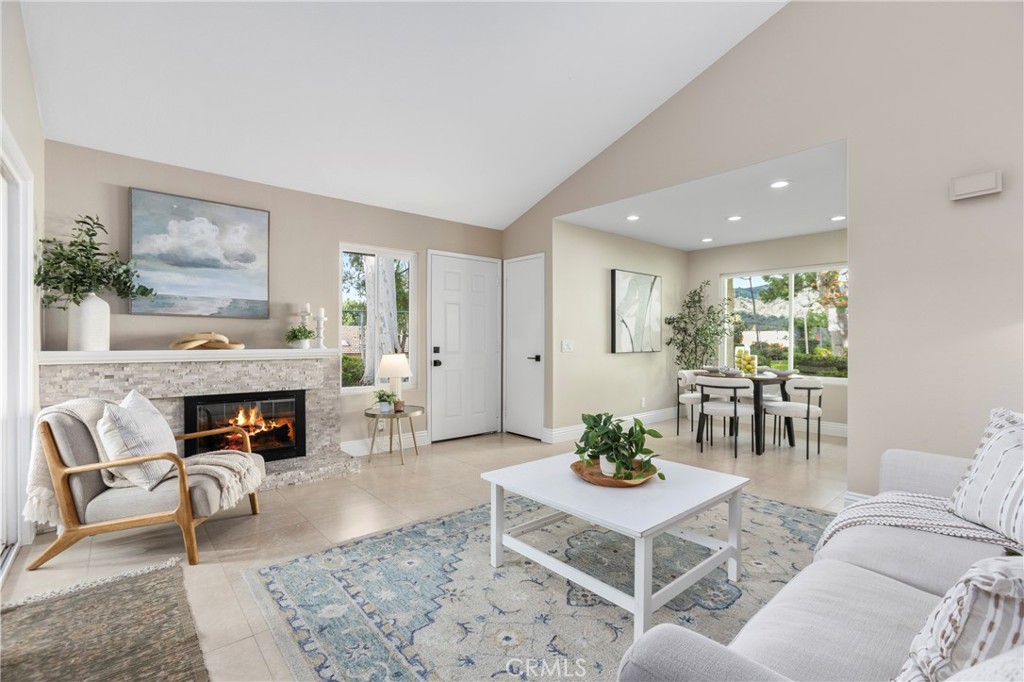 143 Timberline Court Brea, CA 92821 - Photo 2 of 35 a living room with furniture a fireplace and a table
