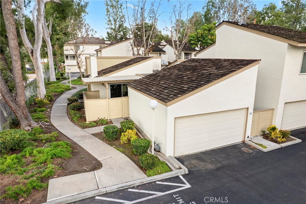 143 Timberline Court Brea, CA 92821 - Photo 35 of 35 a view of a wooden house with a yard and potted plants
