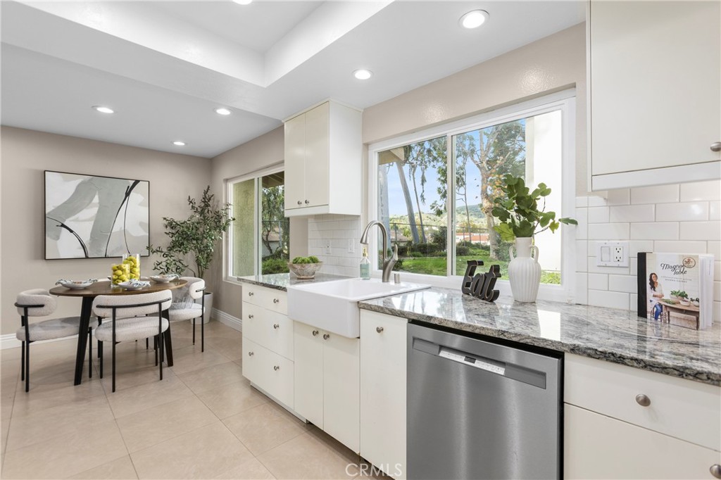 143 Timberline Court Brea, CA 92821 - Photo 8 of 35 a kitchen with sink a window and chairs