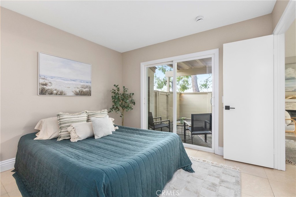 143 Timberline Court Brea, CA 92821 - Photo 10 of 35 a bedroom with a large bed and wooden floor