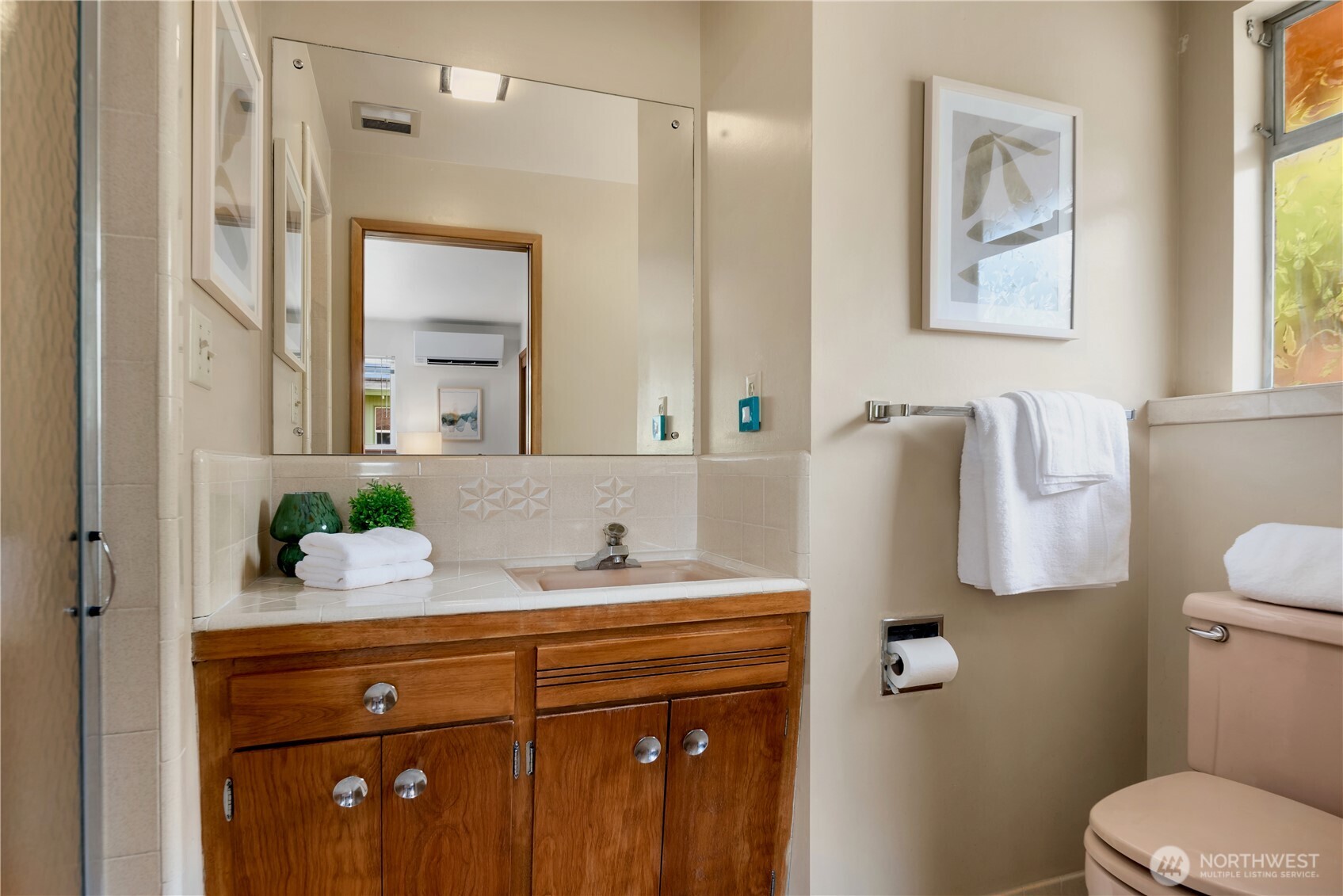 4241 Southwest Donovan Street Seattle, WA 98136 - Photo 21 of 40 a bathroom with a granite countertop sink mirror and toilet