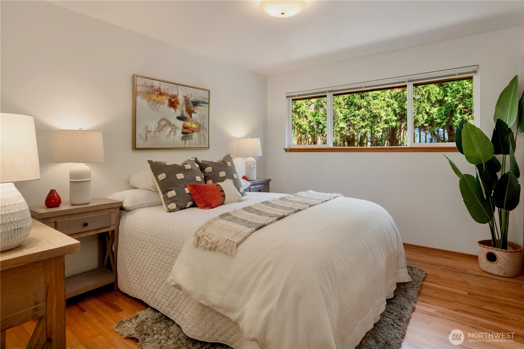 4241 Southwest Donovan Street Seattle, WA 98136 - Photo 22 of 40 a bedroom with a bed and a potted plant