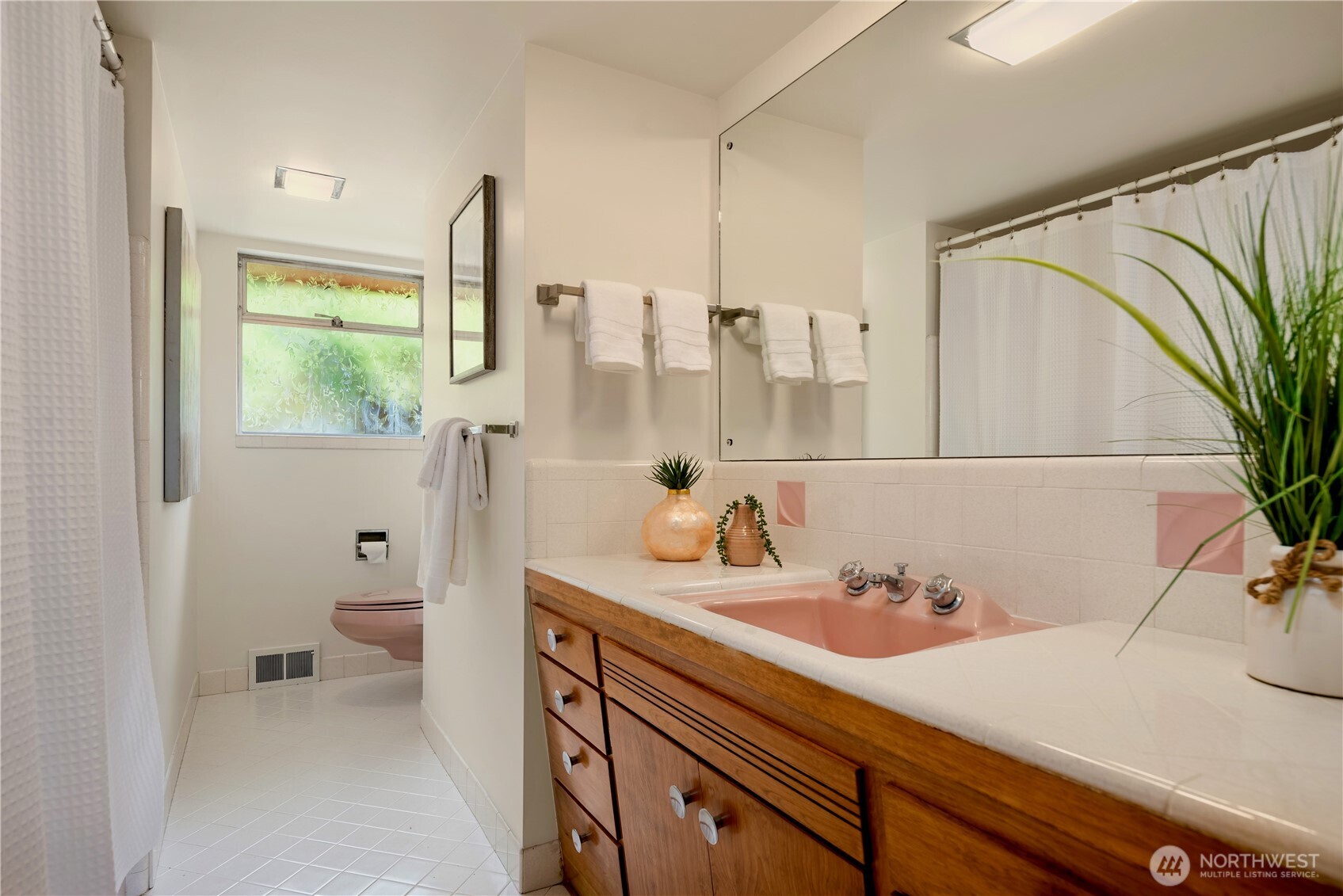 4241 Southwest Donovan Street Seattle, WA 98136 - Photo 24 of 40 a bathroom with a sink and a mirror