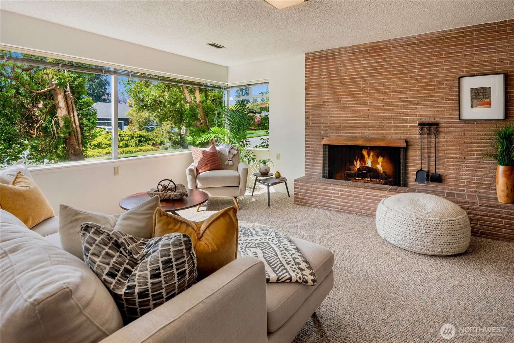 4241 Southwest Donovan Street Seattle, WA 98136 - Photo 27 of 40 a living room with furniture and a fireplace