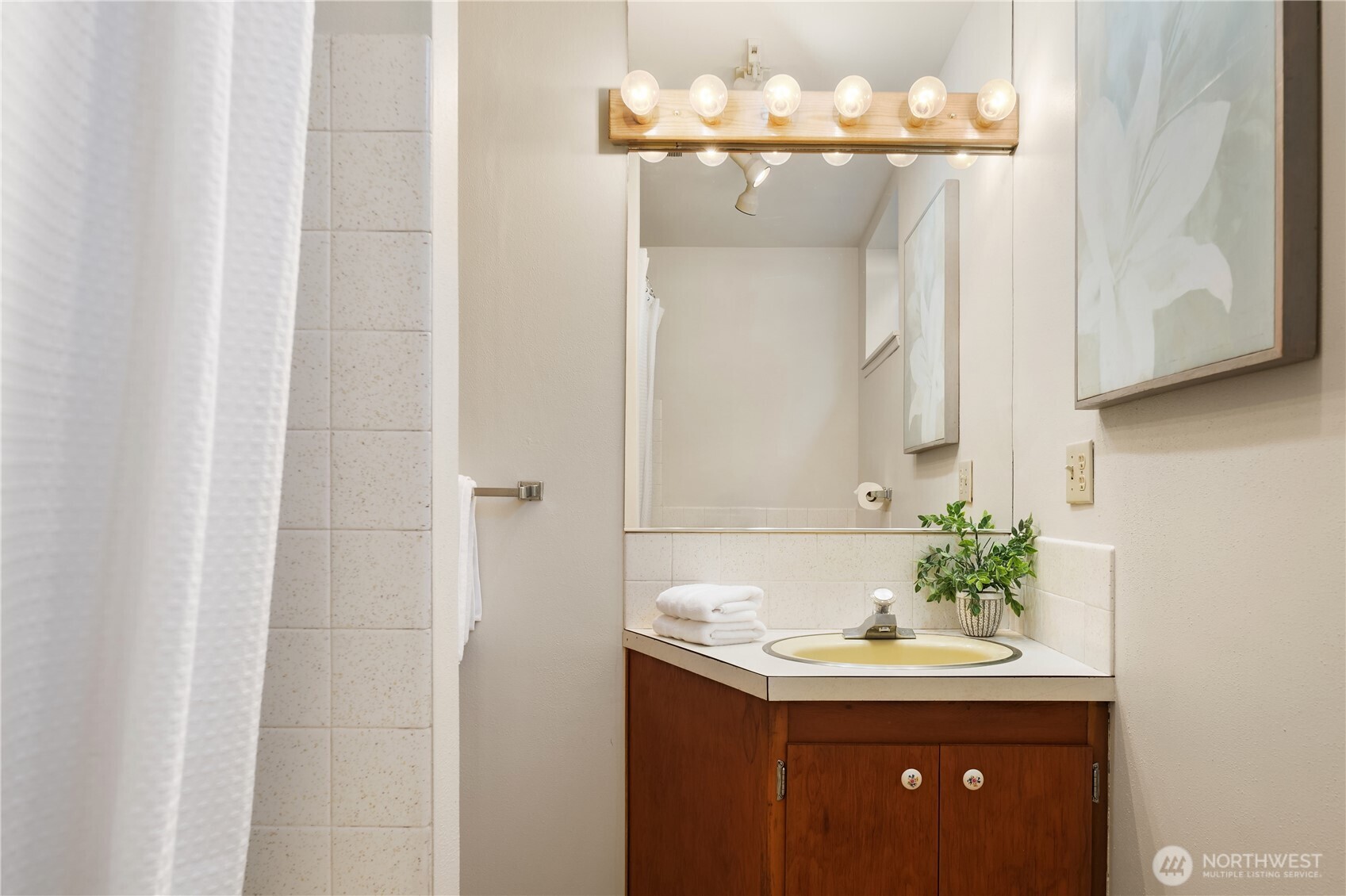 4241 Southwest Donovan Street Seattle, WA 98136 - Photo 30 of 40 a bathroom with a sink and a mirror