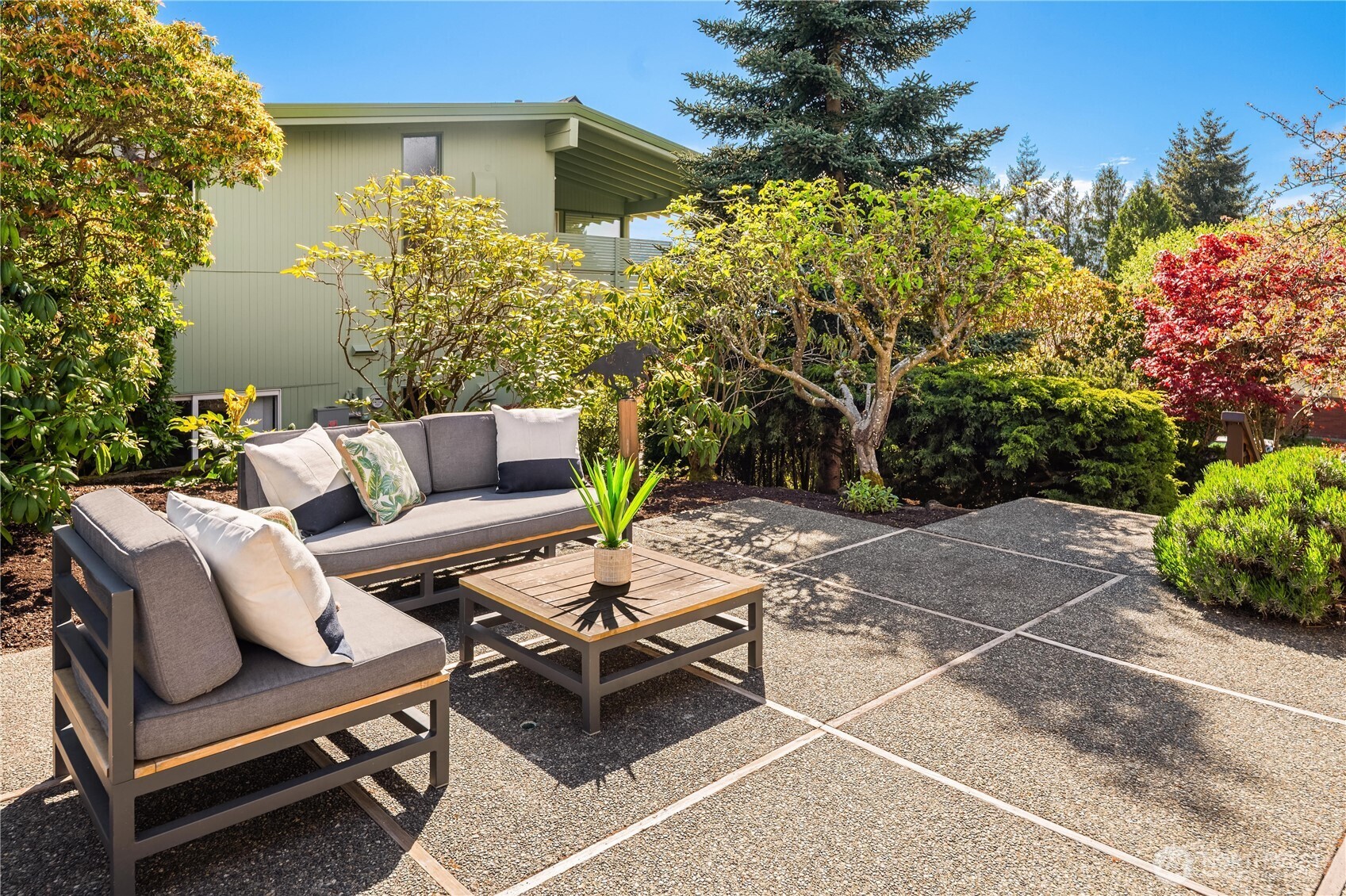 4241 Southwest Donovan Street Seattle, WA 98136 - Photo 31 of 40 a view of a backyard with furniture and a garden
