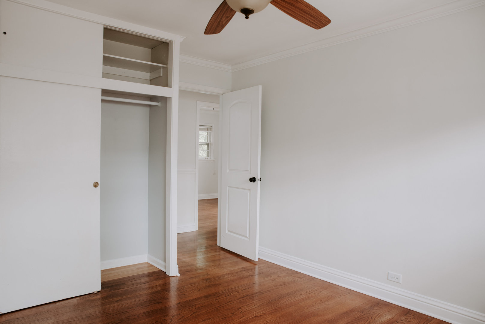 906 Sunset Road Wheaton, IL 60189 - Photo 13 of 32 a view of an empty room with wooden floor