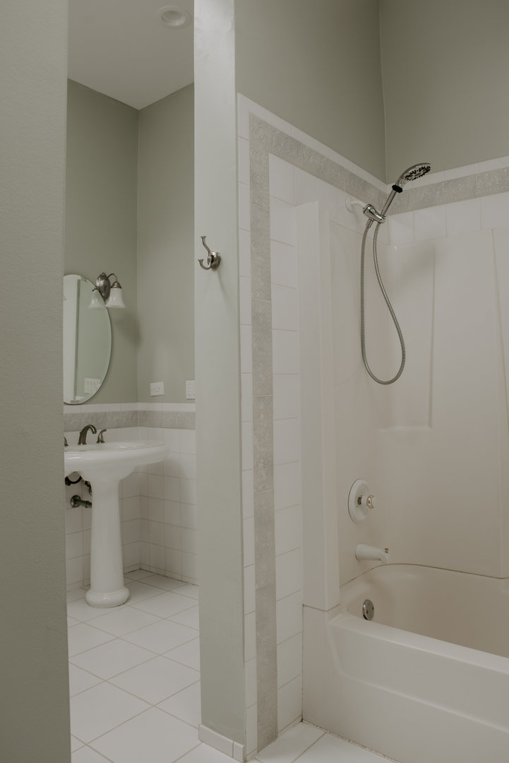 906 Sunset Road Wheaton, IL 60189 - Photo 17 of 32 a bathroom with a granite countertop shower and a sink