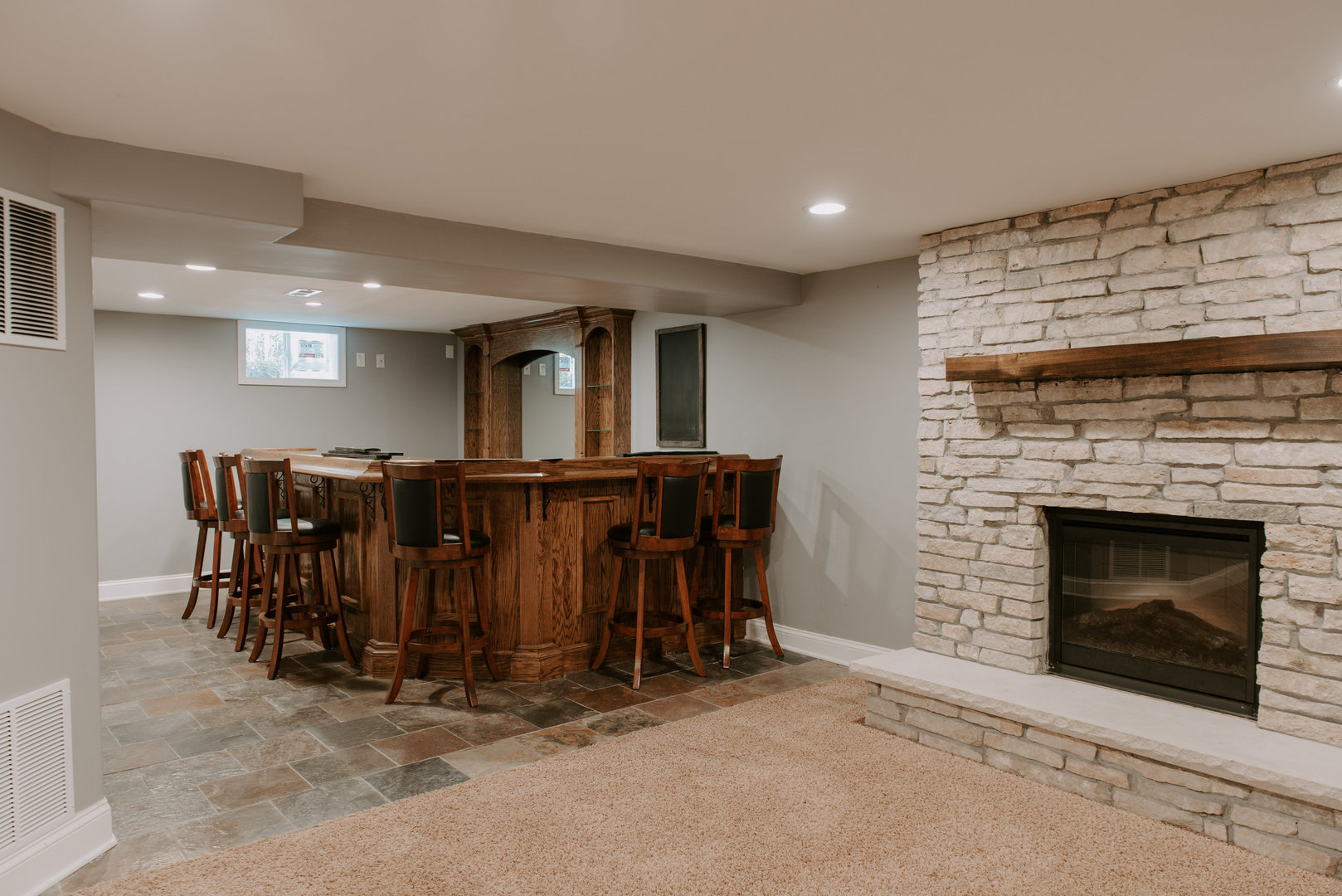 906 Sunset Road Wheaton, IL 60189 - Photo 22 of 32 a living room with furniture a dining table and a fireplace