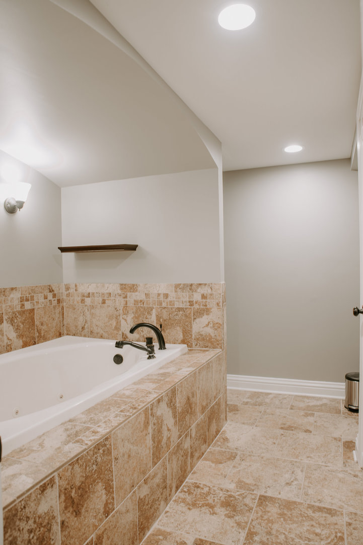 906 Sunset Road Wheaton, IL 60189 - Photo 26 of 32 a bathroom with a sink and a tub