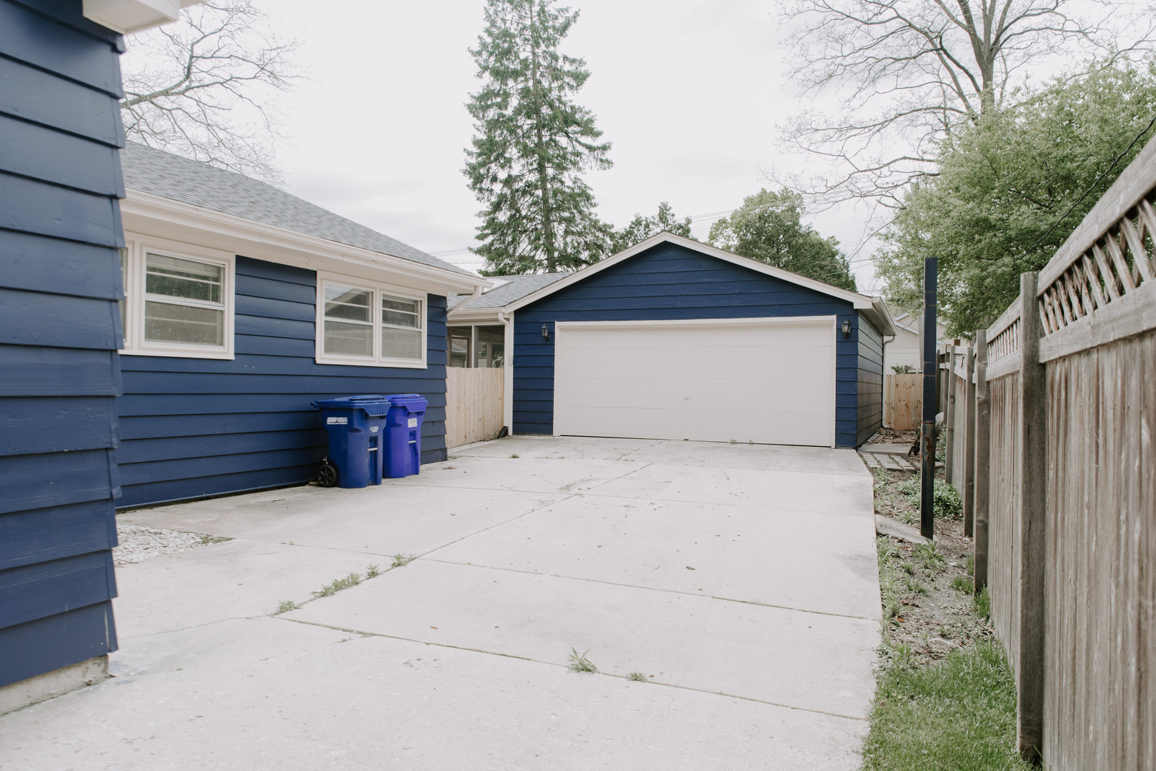 906 Sunset Road Wheaton, IL 60189 - Photo 27 of 32 a front view of a house with a yard and garage