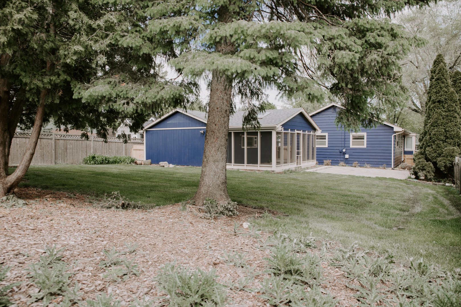 906 Sunset Road Wheaton, IL 60189 - Photo 32 of 32 a front view of a house with a yard and trees