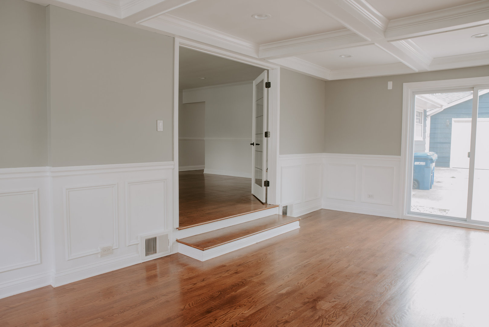906 Sunset Road Wheaton, IL 60189 - Photo 7 of 32 an empty room with wooden floor and windows