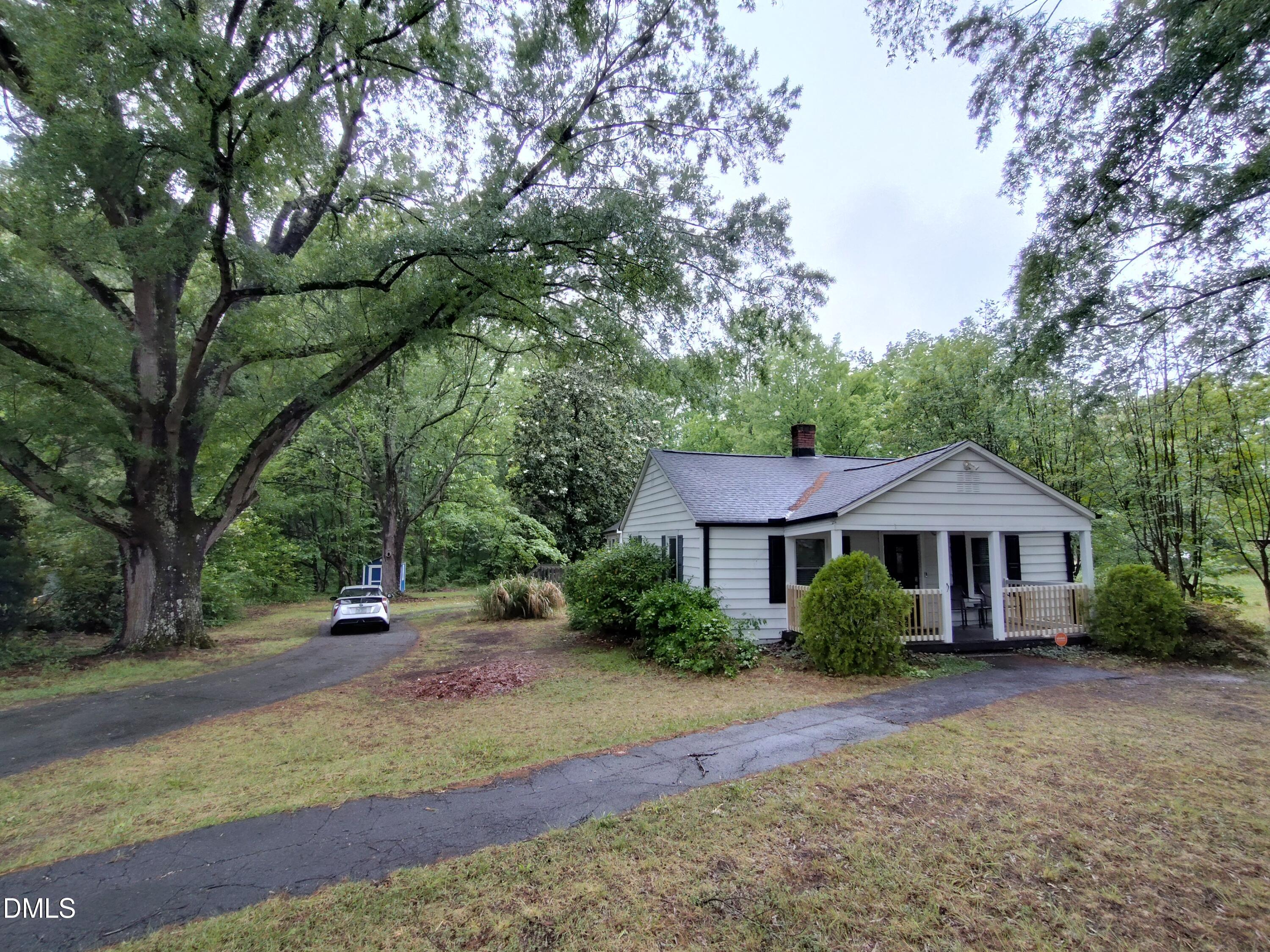 808 Glenco Road Durham, NC 27703 - Photo 2 of 17 a front view of a house with a yard and tree s