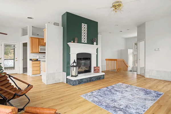 a workspace with wooden floor and a window