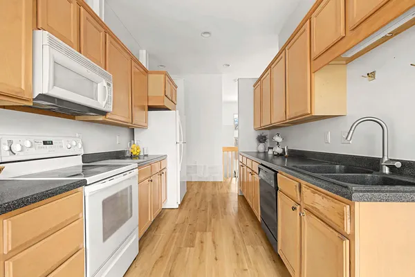 a kitchen with a sink and cabinets