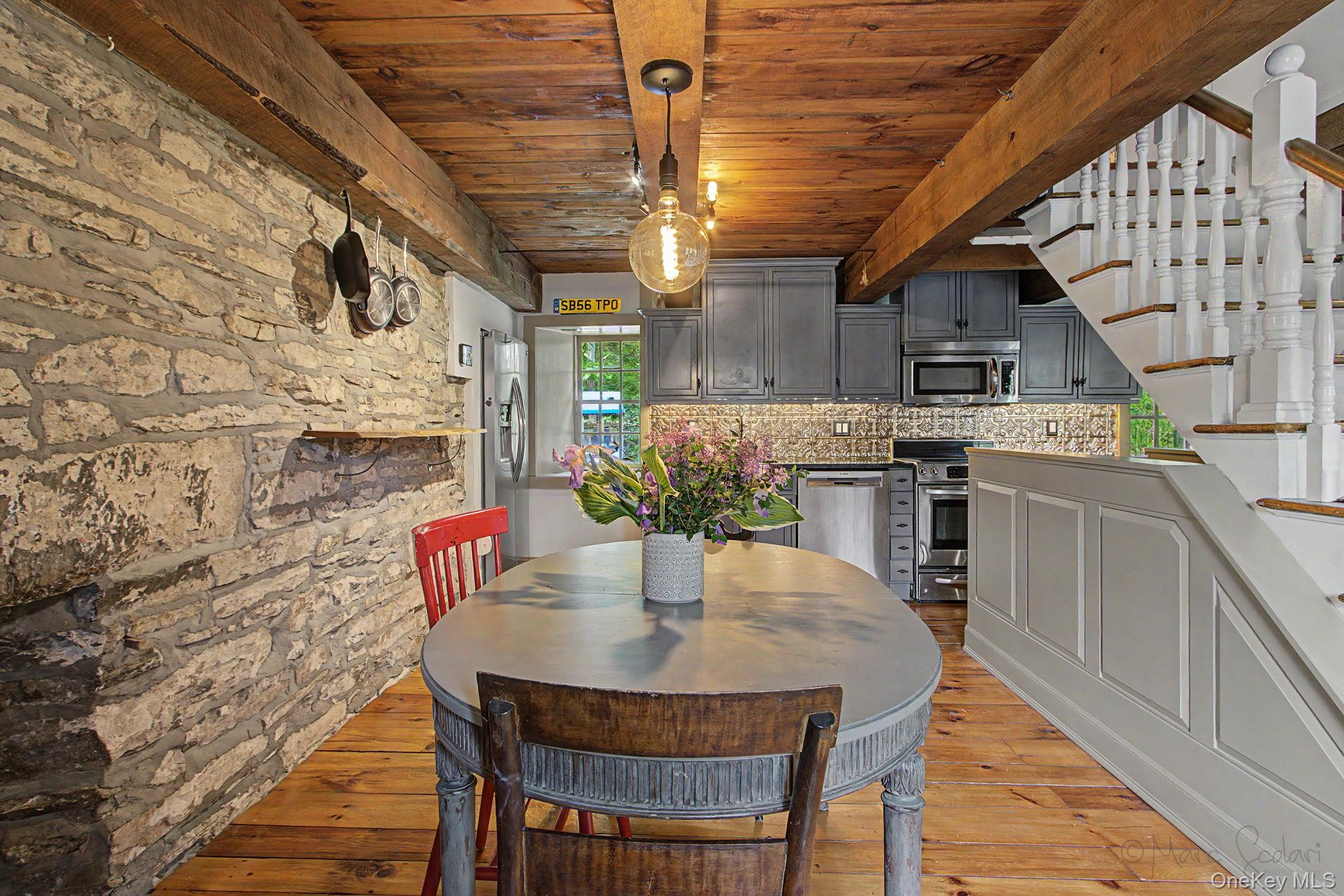 168 Old Rte 55 Pawling, NY 12564 - Photo 10 of 43 a kitchen with a table chairs and stove