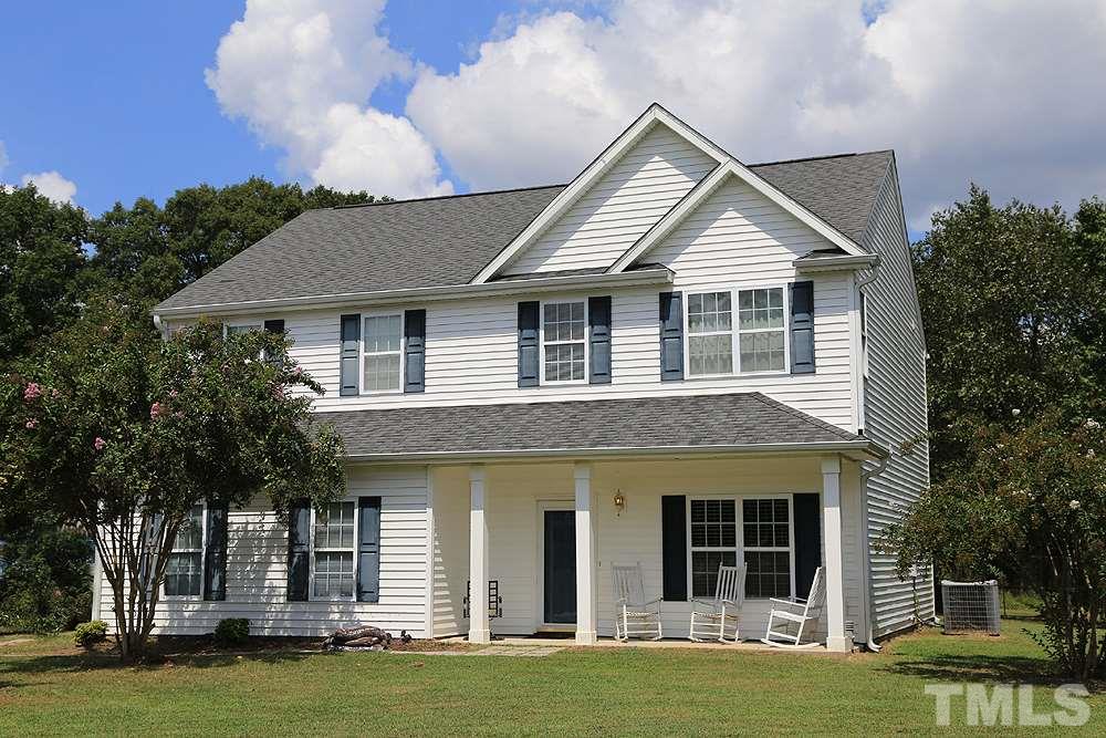 4609 Pearl Road Raleigh, NC 27610 - Photo 1 of 12 a front view of a house with a yard