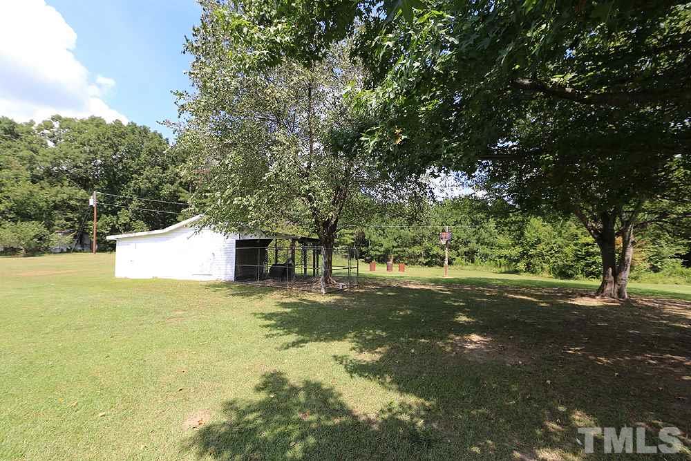 4609 Pearl Road Raleigh, NC 27610 - Photo 11 of 12 a view of a big yard with large trees