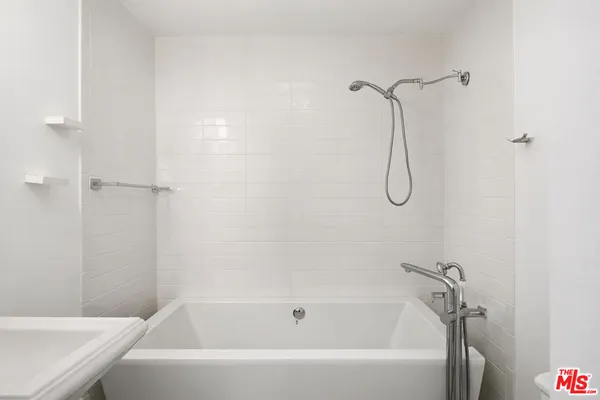 a bathroom with a toilet and a sink