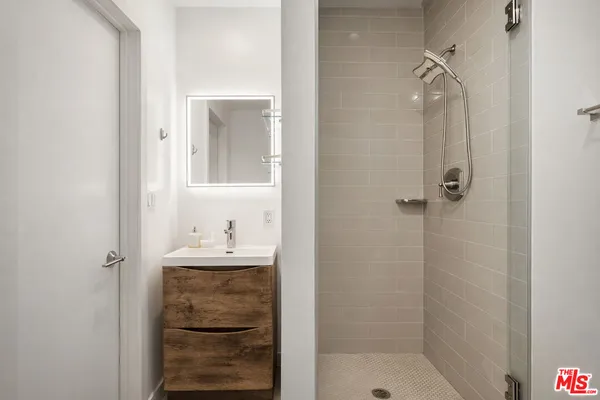 a kitchen with stainless steel appliances a sink stove and refrigerator