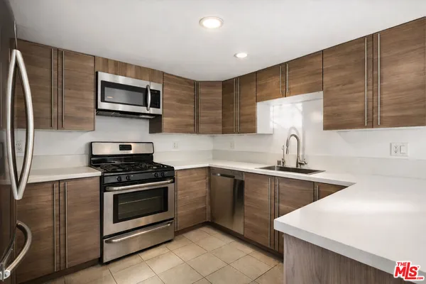 a view of a kitchen with a sink