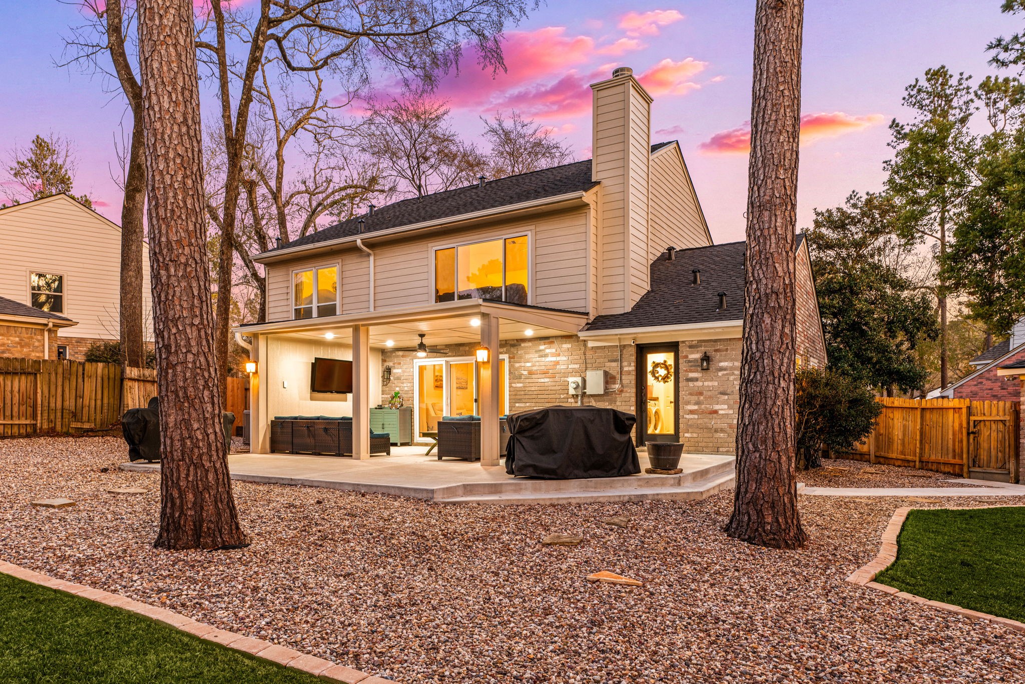 57 Fire Flicker Place Spring, TX 77381 - Photo 7 of 11 The yard is landscaped with stone, lush green grass and shaded by tall trees. Surrounded by a wood fence, your privacy and peace is satisfied.