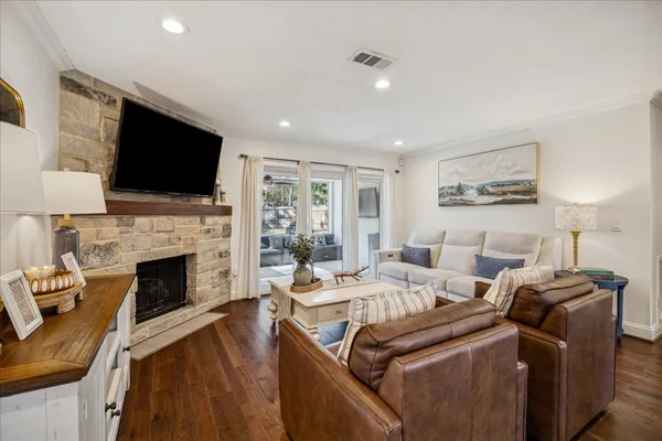 a spacious bedroom with a bed and a ceiling fan