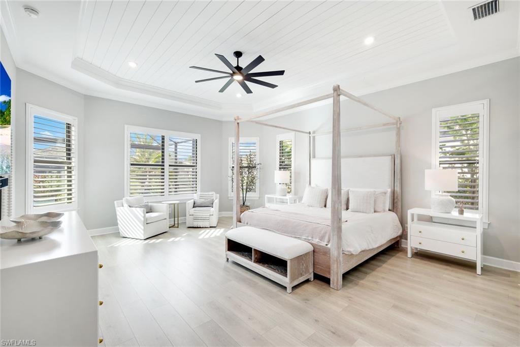 11200 Canal Grande Drive Fort Myers, FL 33913 - Photo 13 of 29 a spacious bedroom with a bed and large window