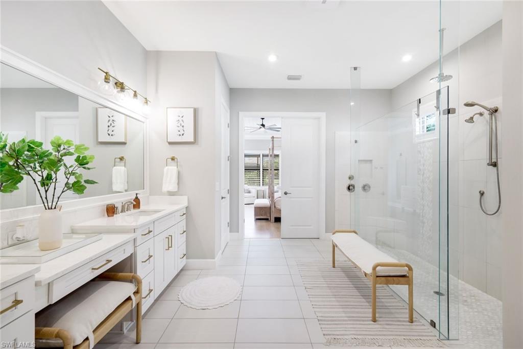 11200 Canal Grande Drive Fort Myers, FL 33913 - Photo 15 of 29 a spacious bathroom with a tub shower and sink