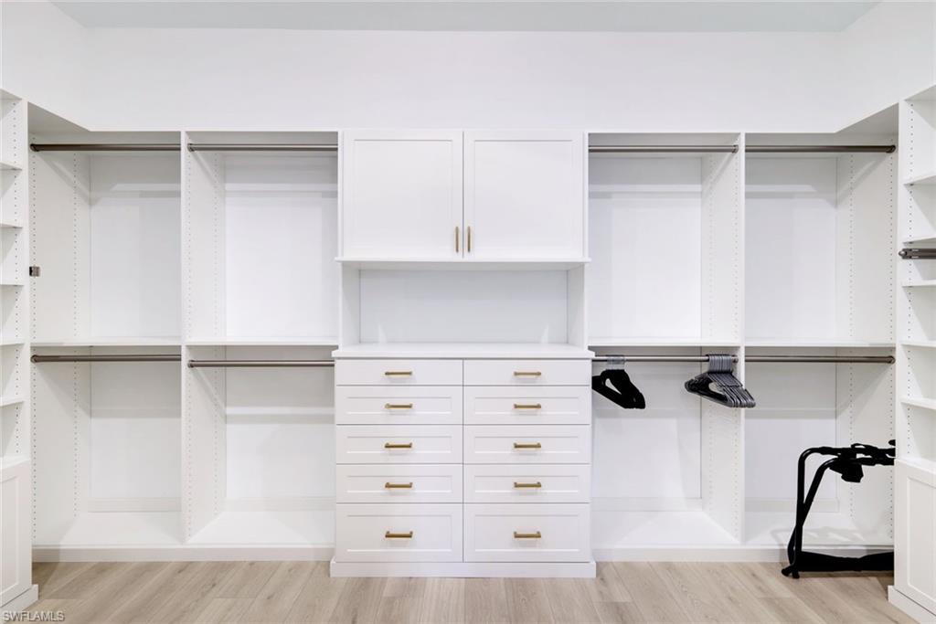 11200 Canal Grande Drive Fort Myers, FL 33913 - Photo 16 of 29 a view of walk in closet with empty racks