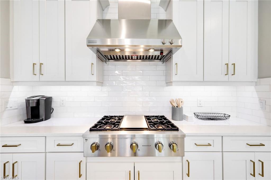 11200 Canal Grande Drive Fort Myers, FL 33913 - Photo 9 of 29 a stove top oven sitting inside of a kitchen