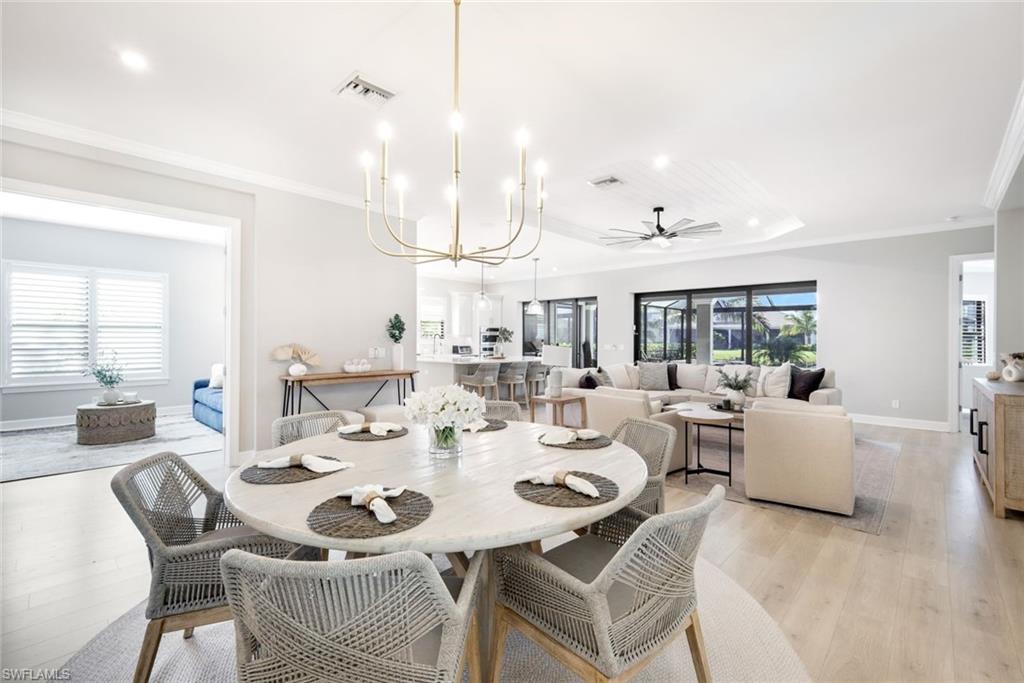 11200 Canal Grande Drive Fort Myers, FL 33913 - Photo 10 of 29 a view of a dining room with furniture and wooden floor