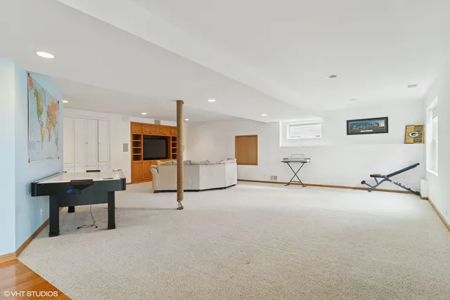 a view of a livingroom with furniture and a flat screen tv