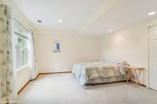 a room with a bed and a cabinets