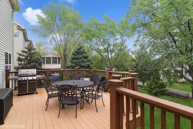 a view of a dinning table and chairs in patio of the house