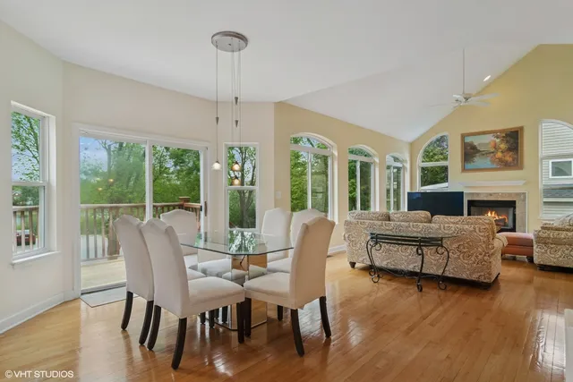 a living room with fireplace furniture and a wooden floor