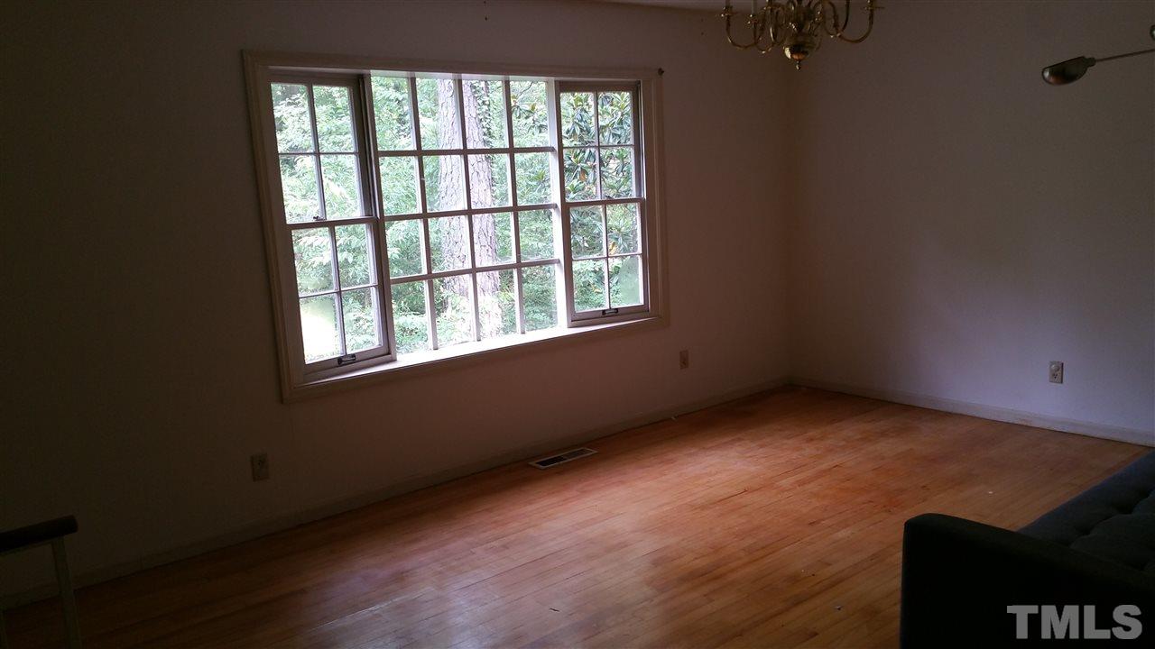 504 Old Farm Road Raleigh, NC 27606 - Photo 4 of 6 an empty room with a window