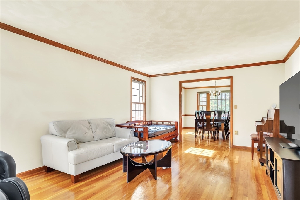 7 Stouffer Circle Andover, MA 01810 - Photo 12 of 37 a living room with furniture and a wooden floor
