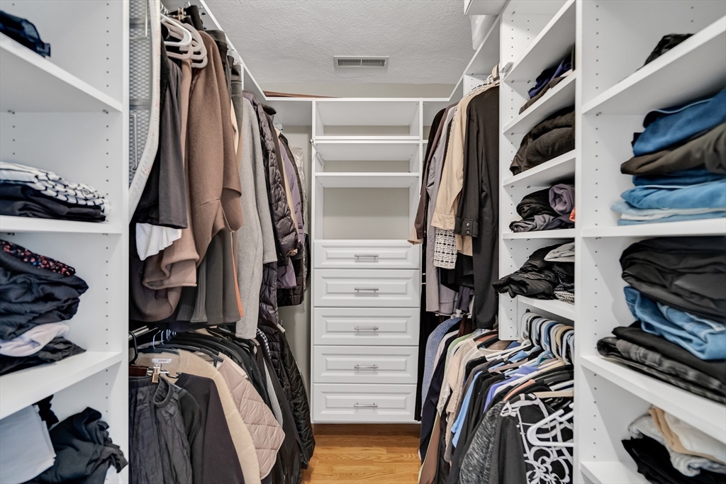 7 Stouffer Circle Andover, MA 01810 - Photo 16 of 37 a view of walk in closet with clothes and shoes