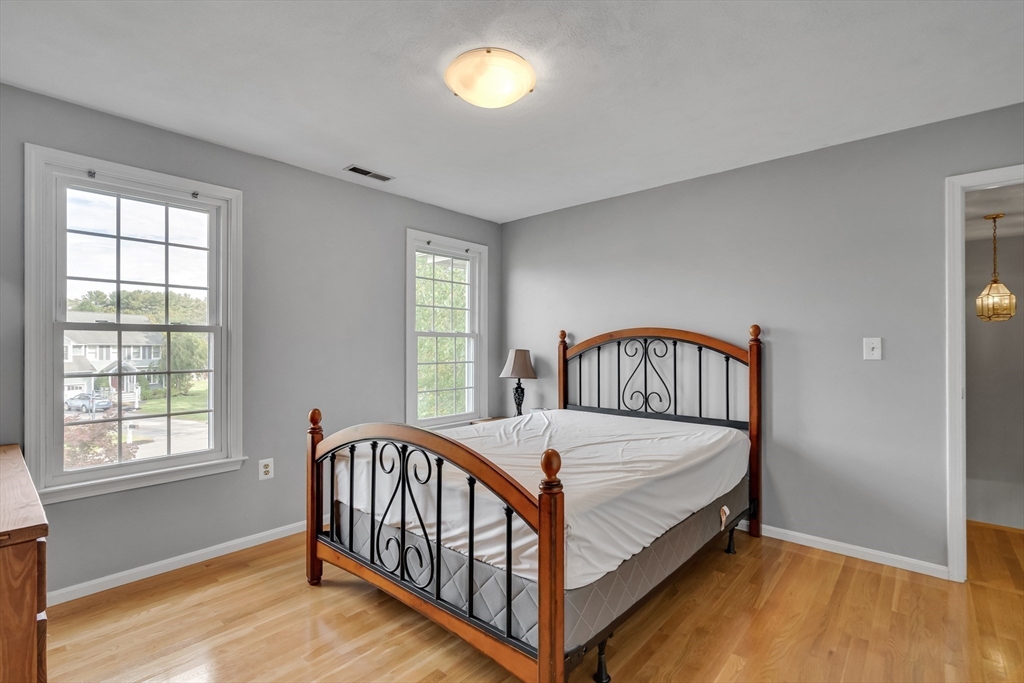 7 Stouffer Circle Andover, MA 01810 - Photo 22 of 37 a bed sitting in a bedroom next to a window