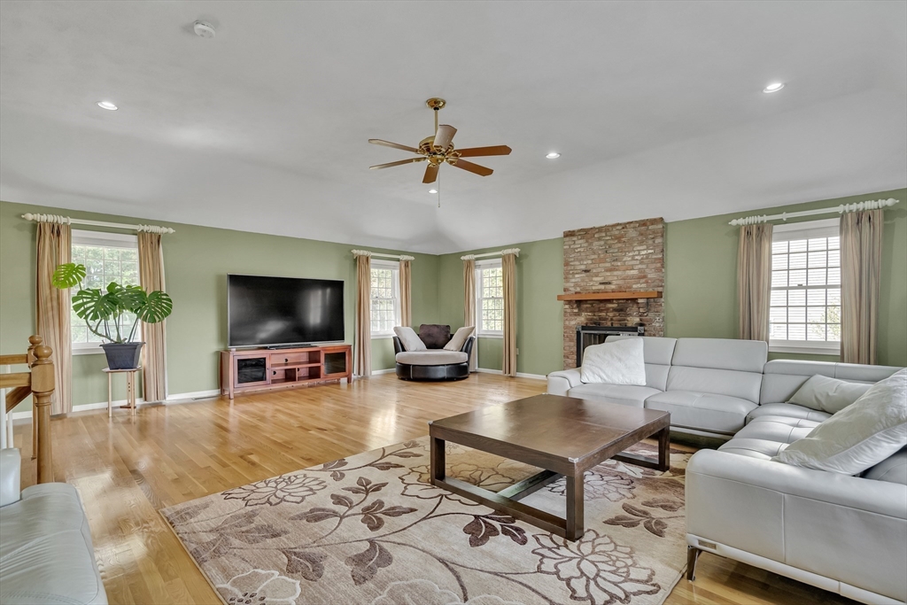 7 Stouffer Circle Andover, MA 01810 - Photo 3 of 37 a living room with furniture a flat screen tv and a window